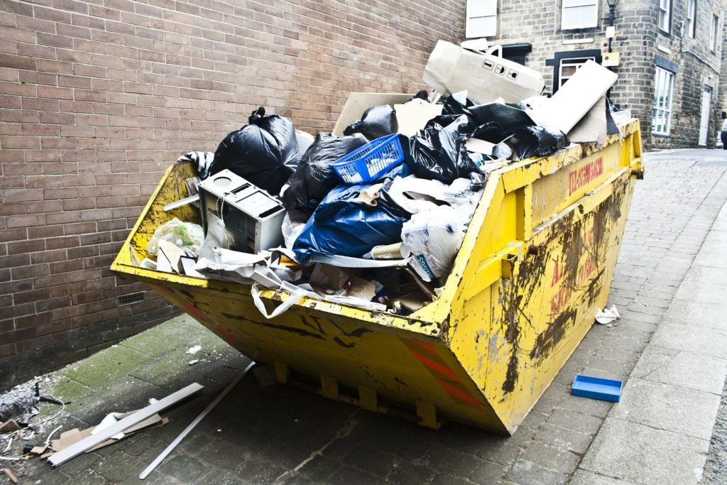 a row of dumpsters cleaned with granular deodorant